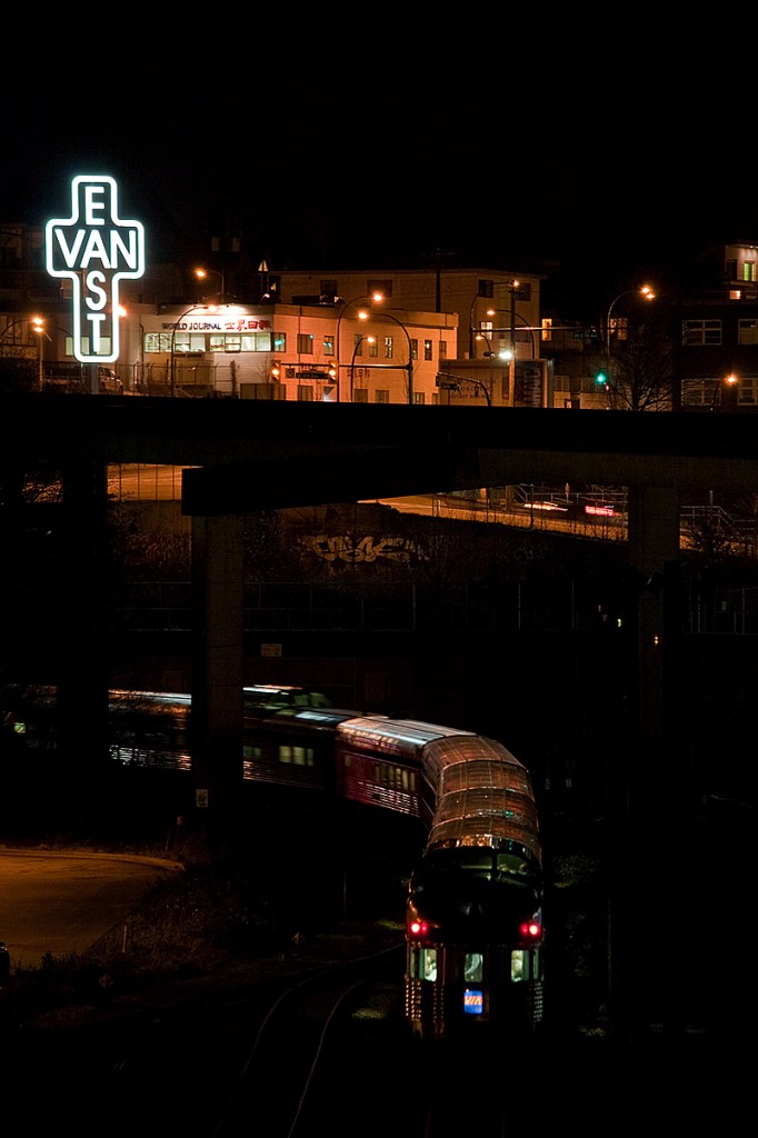 Vias classic passenger train The Canadian has departed Vancouvers Pacific Central station moments before, on its way to Toronto with holiday travellers and tends to be a long train for low season. Standing above train 2 is an artists statue, that was put in place prior to the Vancouver 2010 Olympic and Paralympic Games.