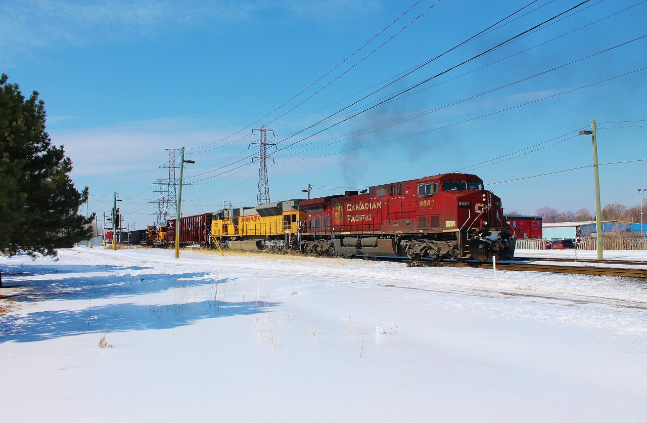 After I finished a morning of some of my worst bowling I've ever done I decided to see if there was anything coming on CP. Lucky for me 234 had a UP SD90MAC trailing. So I raced home, grabbed my gear and got back to Dougall with a couple of minutes to spare. The other two trains I caught that day (241 and 244) also had UP power as well.