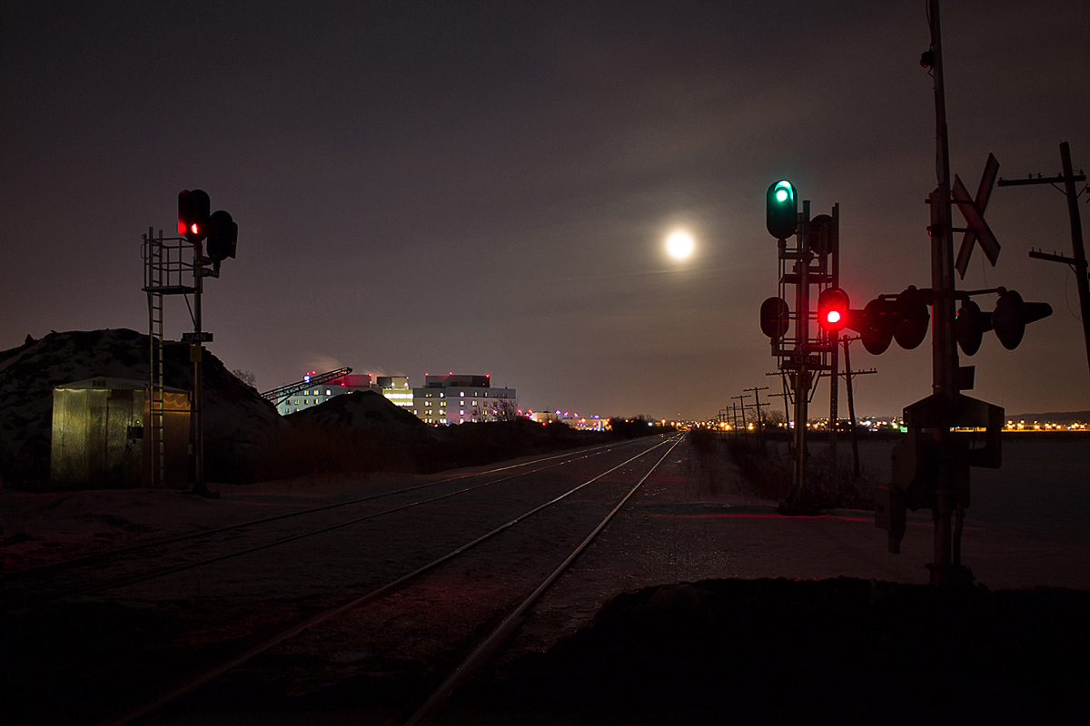 Armageddon? Nah, its just a full moon with light cloud cover in front of it. Meanwhile, CN 330 is lined up on the south main with a clear signal displayed at Third Street Louth.