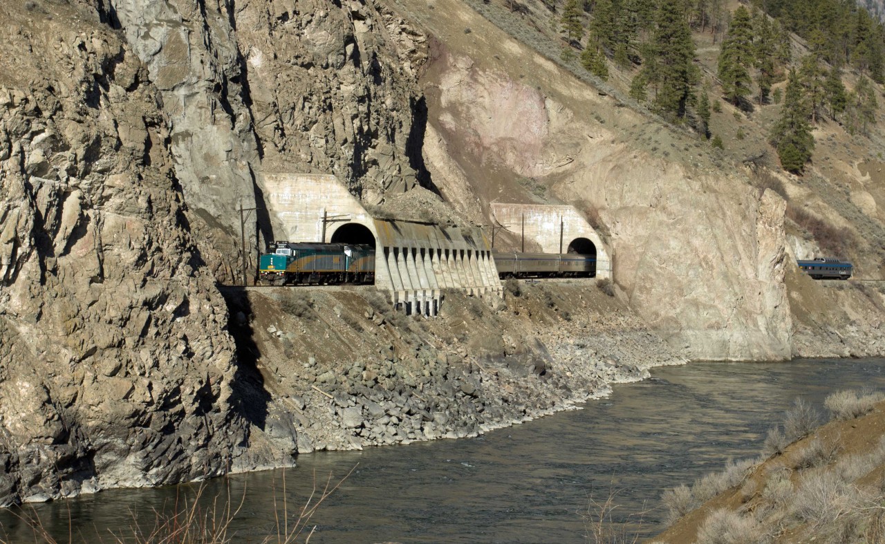 Running 7 hours late, VIA Canadian makes rare daylight appearance alongside Thompson River.
