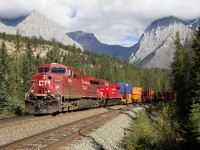 On a nice sunny afternoon, a CP priority stack train heads west through Leanchoil, as Mount Chancellor stands tall in the background. 