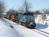 CEFX 1019 leads BNSF 4692 through Puslinch on a cold day after freezing rain put a layer of ice over all the snow. 
