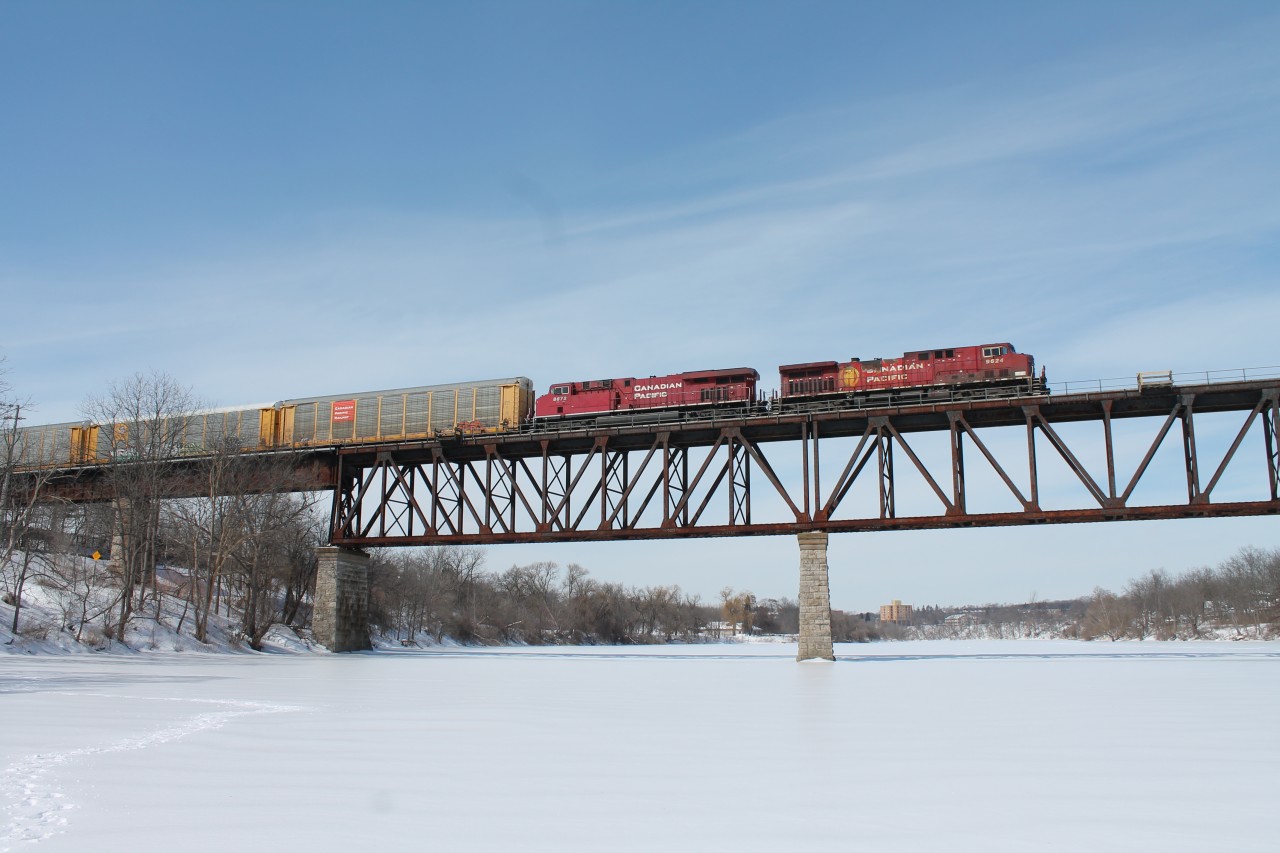 CP 9624 leads CP 8872 over the Grand River Bridge on a cool,windy winter day.
Taken from the middle of the frozen Grand River after a 2 hour wait.
Cambridge Rowing club in background.