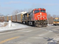 CP 147 with no CP locomotives heads west under sunny but cold March skies. Here we see it accelerating out of Wolverton at the hamlet of Drumbo with CN 2652 and CSXT 8033 as the power. Interesting to see CN power leading a CP freight again. Time - 16:19.