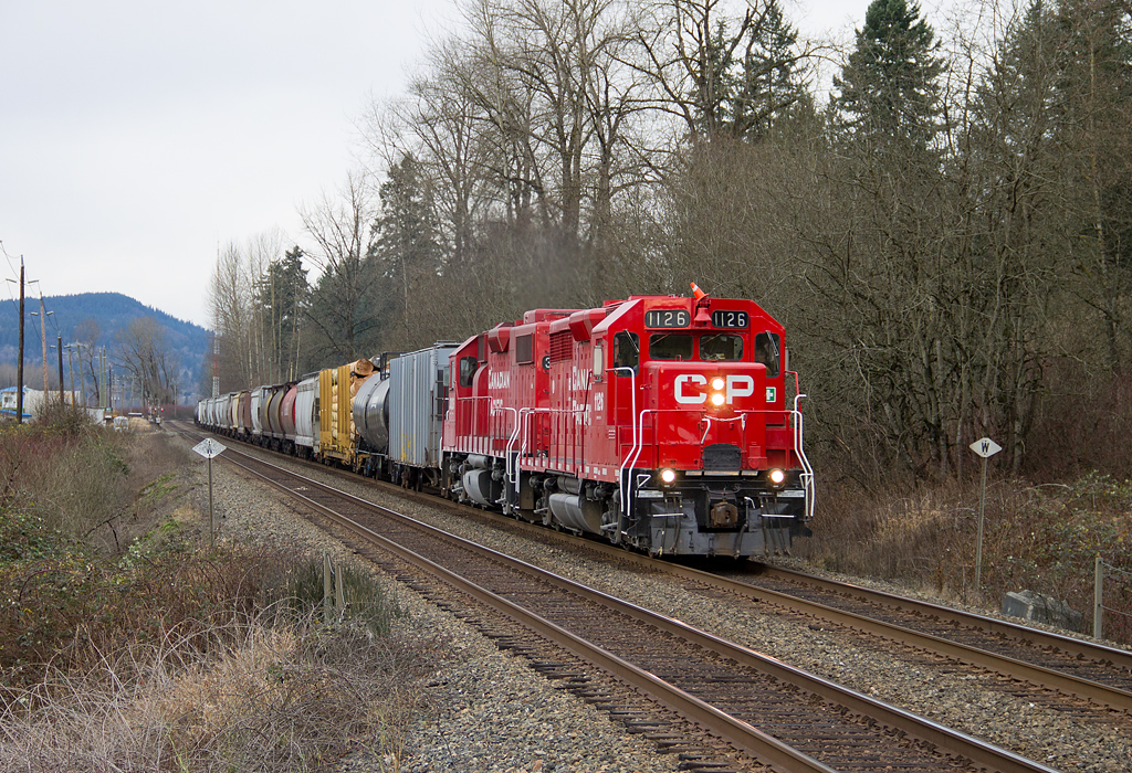 Looking all new and shiny, CP Cab Control 1126 leads CPs Sumas Turn (Port Coquitlam - Sumas Border) through Silverdale, BC, west of Mission. 1126 is a former GP35 and was sent back east to Montreal last Summer for rebuild.