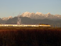 On a extremely nice, brisk New Years Eve 2014, WCEX F59PHI 905 leads the second West Coast Express to leave Downtown Vancouver for Mission. The train has just crossed the Pitt River Bridge and is framed nicely under the Golden Ears Mountain. Southern BC experienced an very nice few weeks during this Winter, in which we received rare sunshine, which allowed the Coastal Mountains to stand out. What was also rare on this occasion was West Coast Express in daylight. As it was New Years Eve, two of the five trains left Vancouver early. 