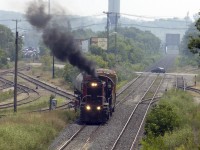 Not a steam engine, but close to the same view of Merritton as that captured by Mr. Mooney in his 1980 photo of CNR 6060.  Note the changes to the track layout, for Trillium to cross the main and run south to Thorold involves heading a half mile west to the new crossover (behind the photographer).  There is at least, a van in the consist.