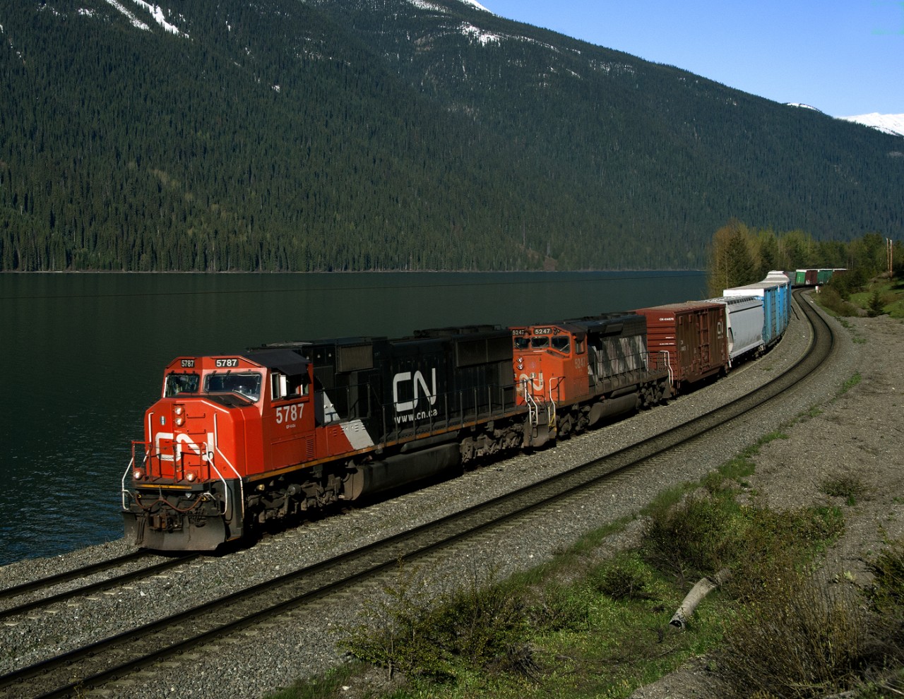 Westbound CN 302 passes Moose Lake at the base of Yellowhead Pass.