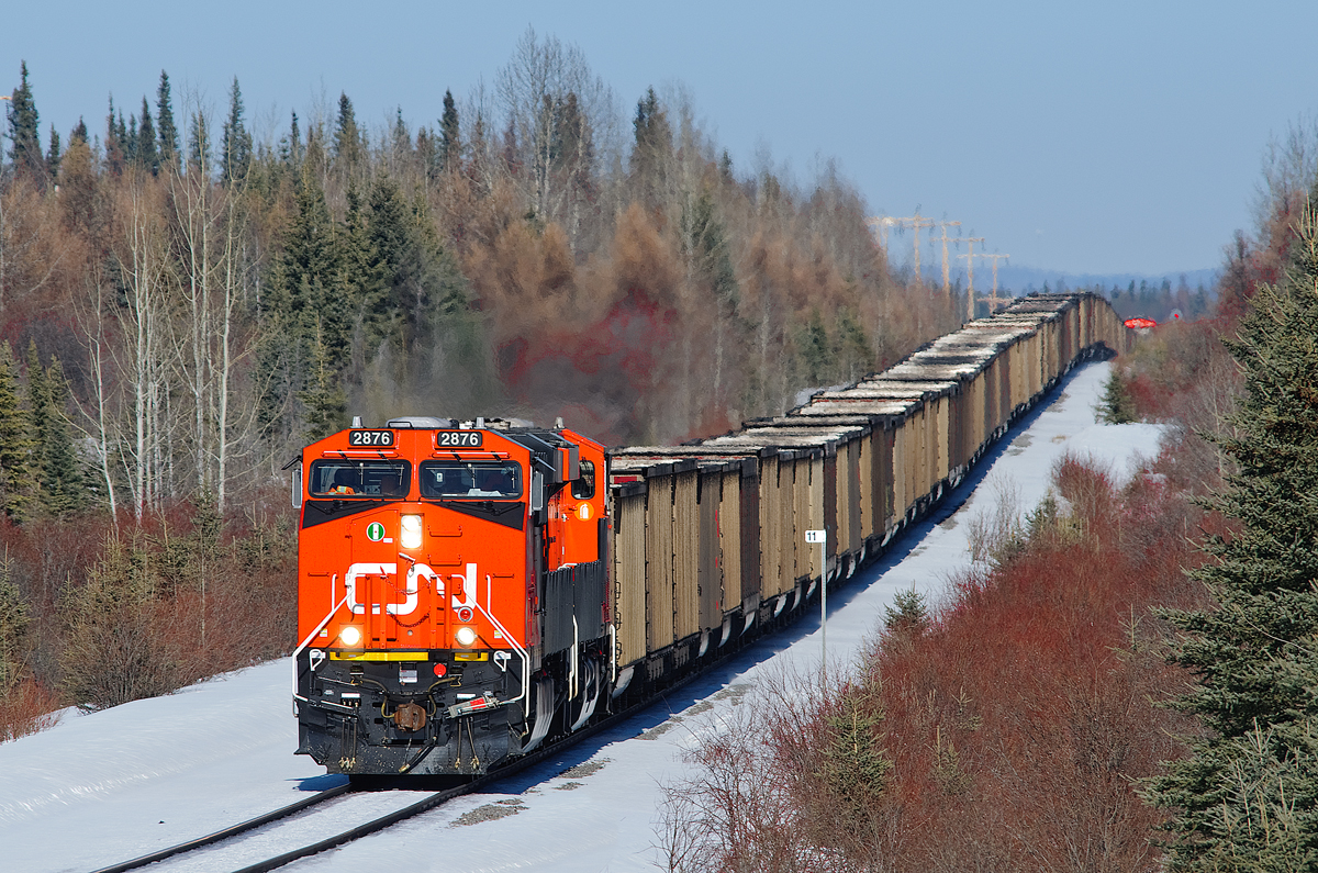 112 coal empties for Coal Valley negotiate the rollercoaster Foothills Sub. New CN ES44ACs 2876, 2914 and 2899 (seen on the rear) provide the power. While all 3 units certainly aren't needed for the westward trip, they'll definitely be in use lugging the loads back east.