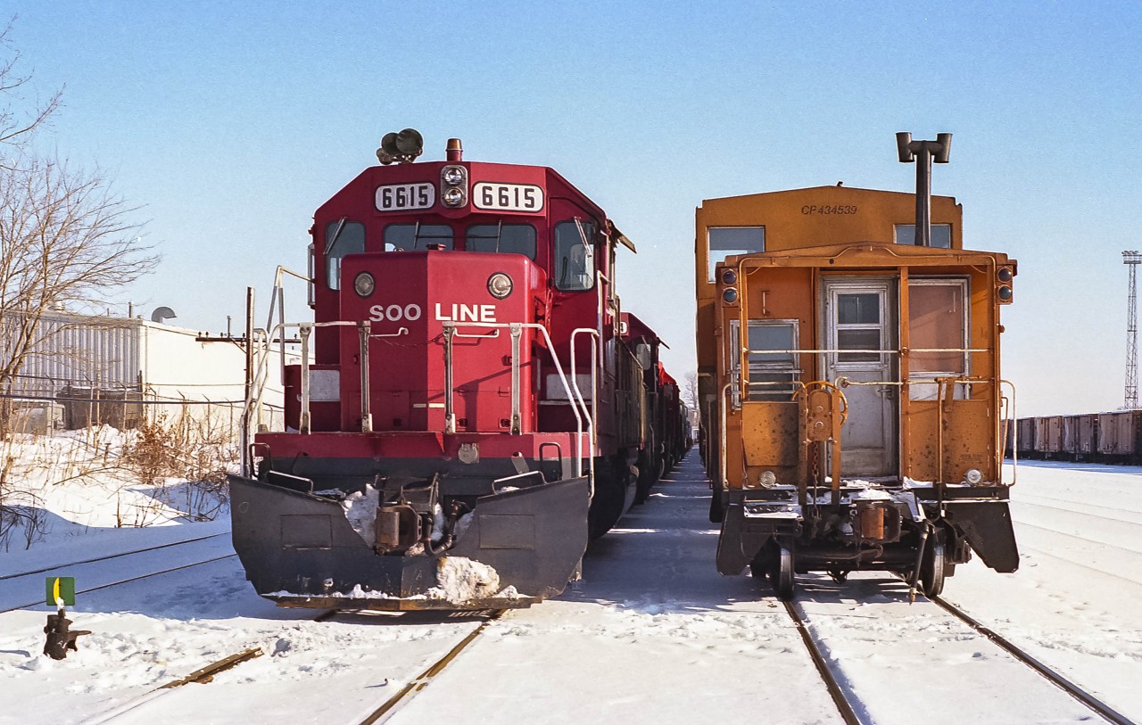 Christmas Day is the only quiet day of the year on the CP, a good day to get a few photos of trains tied up for the holiday. This SD40-2 is only 4 years old but will be repainted in 2006 to the beaver scheme and still bear the same number. Of course the van is now a piece of history itself.