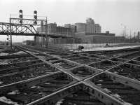 The West Toronto Diamond in January 1975, the junction of CP's Galt, Mactier and North Toronto subs, and CN's Brampton sub.  To the left was the CPR West Toronto station, to the right was CN's West Toronto Station.  The tracks heading under the signal bridge lead to Lambton Yard, on the other side of the Old Weston Road bridge.  And behind the photographer was CP's service track, formerly the Toronto, Grey and Bruce mainline.

Pretty much everything in this photo is gone now, the Old Weston Road bridge was closed to road traffic in 1972 and demolished in 1981.  It was one of the best vantage points in Toronto to watch trains. 

The diamond was taken out of service May 23, 2014, after 130 years of service, when the grade separation for the Union Pearson Express was competed