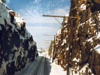 The view from the cab of the last VIA Canadian to travel the CPR route, passing through a rock cut on the north shore of Lake Superior.  