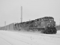 A late 421 runs through the Merriton Juction, just as the snow starts to come down.