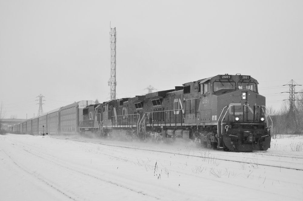 A late 421 runs through the Merriton Juction, just as the snow starts to come down.