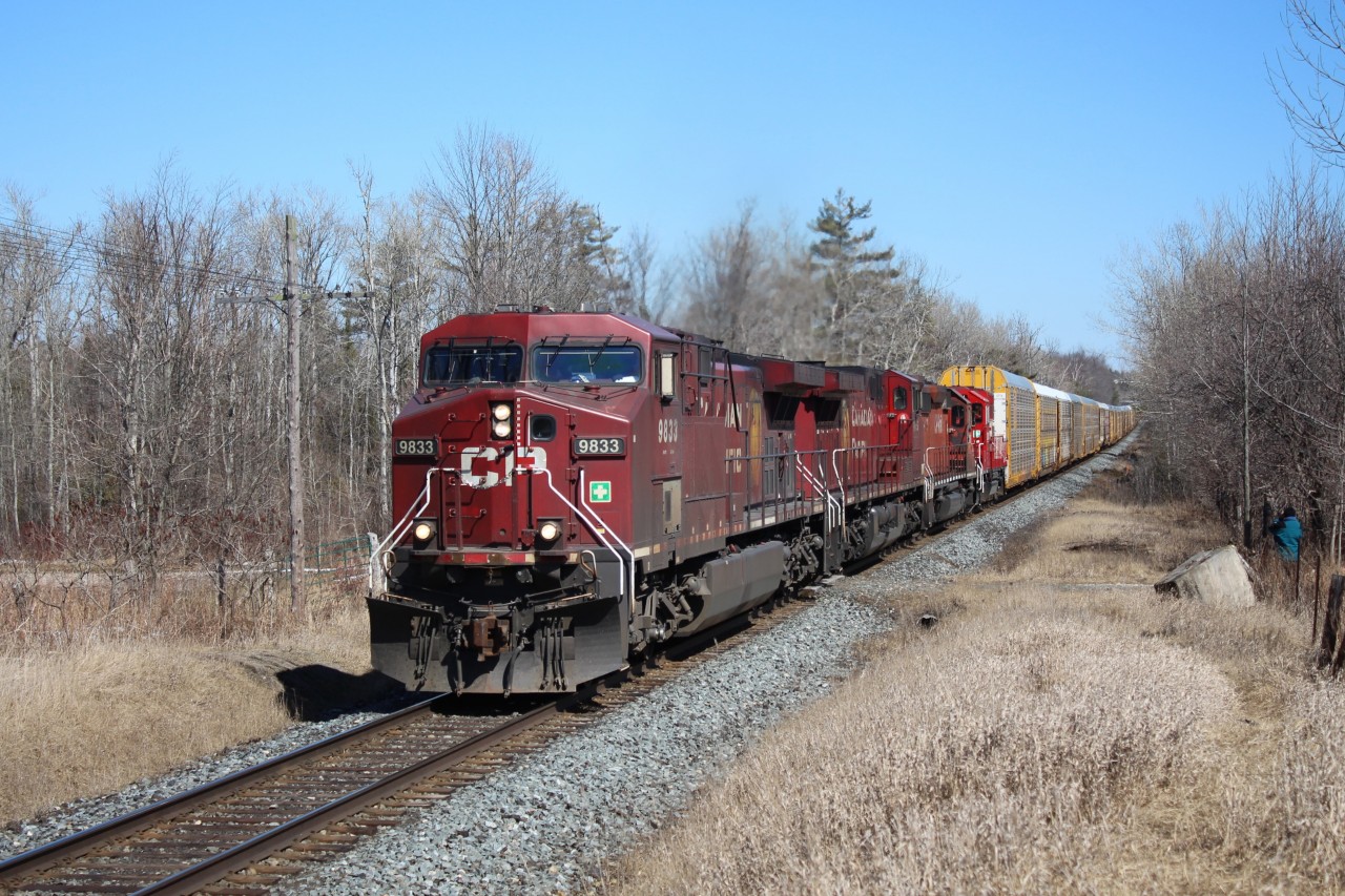 CP 9833 leads CP 9655, CP 5906 and CP 2261 into Puslinch on a bright sunny April 1st hauling a load of auto racks cleared to Wolverton. Was a popular day for railfans at MM43 for a slow day on the Galt sub.