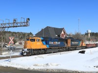 Train 214 is halfway through it's journey from Englehart to North Bay as it passes in front of the station in Temagami.  It's sad that this building no longer welcomes train passengers since the discontinuation of the Northlander in 2012.