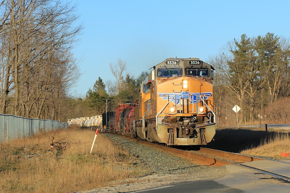 With the day quickly coming to an end and the shadows growing (and ruining several photo locations), a couple of UP engines bring train 420 through Midhurst enroute to Toronto.