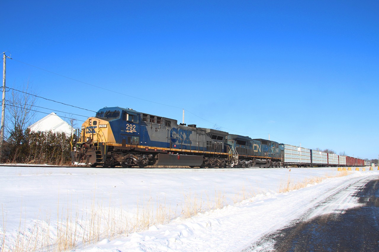 The CN 324 running track speed to St-Albans VT behing some back yard in St-Jean Qc !