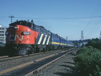 CN FP9A 6542 is leading train #11 "Scotian" a few miles out of Ocean Terminal enroute to Montreal, passing the Simpson-Sears building in Halifax. 