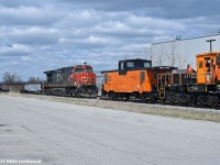 Having arrived at the spur to Ontario Power Generation's Pickering Nuclear generating station, which is a wye, I found it a little odd that the crew chose to run through the west leg of the wye. This necessitated a run around move on the run around track at Clements Road, and I'm sure there was a good reason for this, which allowed for a few shots of the move in a brief period of sun. Still lovin' that van! 1347hrs.