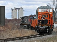 On the curve approaching the entrance to the OPG Pickering compound, HEPX 200 is gingerly eased towards it's final destination. Though it seems odd on the surface to catch a six axle the size of a C44-9W on a seldom used spur, given the weight of the typical shipment on the spur, it's actually pretty appropriate. They even left the buffer gons behind at the run around track a little ways north. 1400hrs.