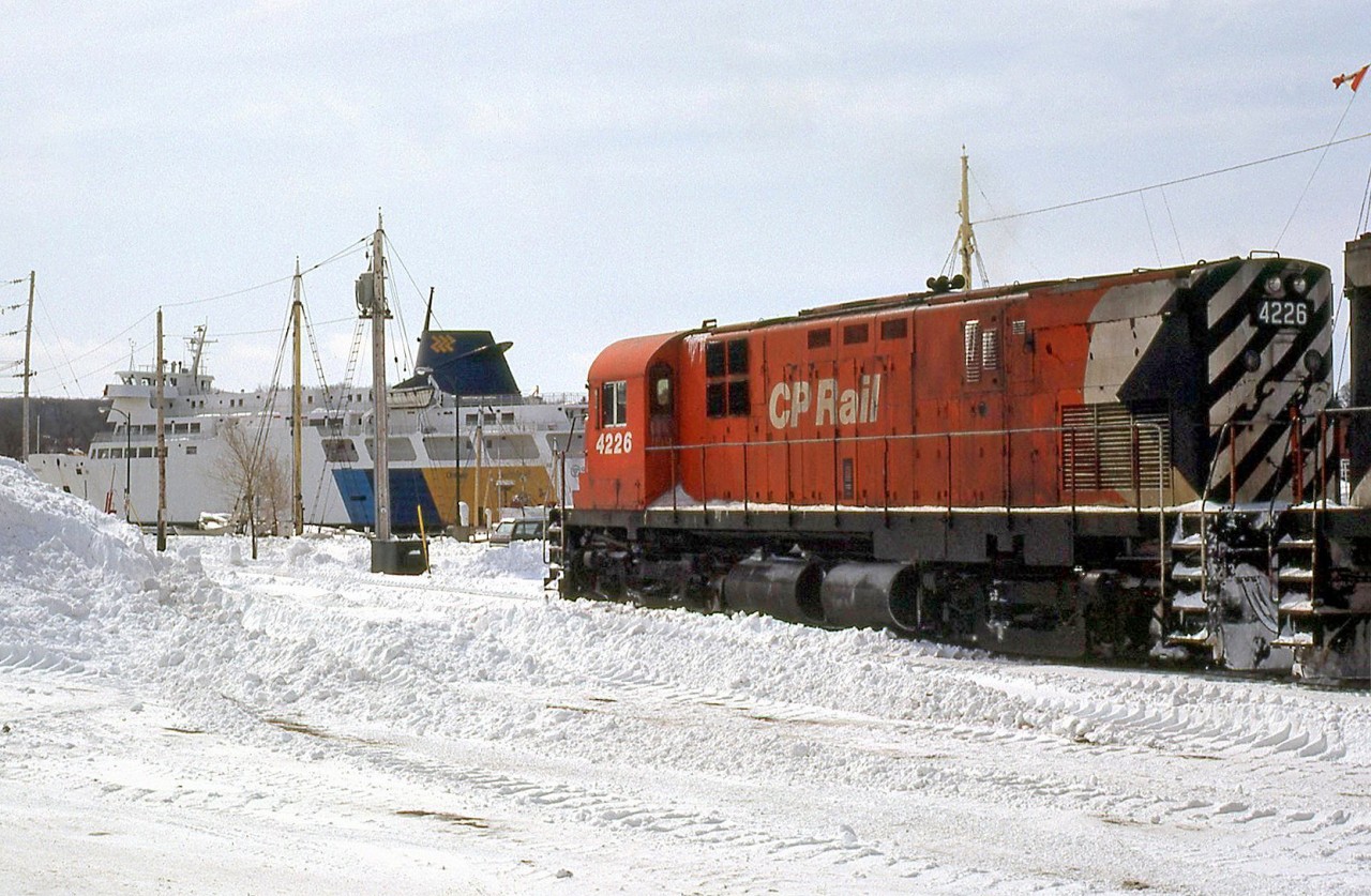 By rail and water: CP C424 4226 is at the "end of the line" in Owen Sound, the northernmost part of the Owen Sound Sub from Orangeville. Parked nearby, Ontario Northland's car and passenger ferry M.S. Chi-Cheemaun (built in 1974 by Collingwood Shipbuilding) is stored for the winter, off of her usual Manitoulin duties on Lake Huron. The last train up here was on October 31st 1995, before the line was abandoned and removed by CP.