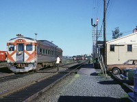 Dominion Atlantic train #3 departed Halifax in the early evening for its trip to Yarmouth. First stop after leaving Ocean Terminal was Rockingham. The operator has just handed up their paperwork as they pull away from the station. 