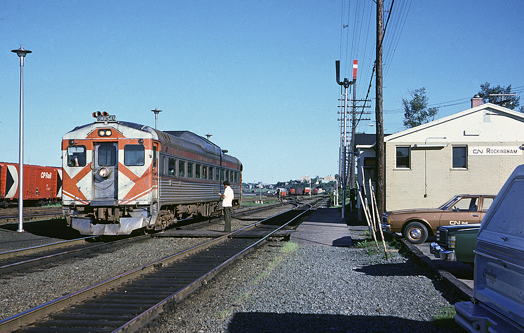 Dominion Atlantic train #3 departed Halifax in the early evening for its trip to Yarmouth. First stop after leaving Ocean Terminal was Rockingham. The operator has just handed up their paperwork as they pull away from the station.