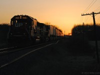 As the sun dips below the horizon, CP 6225, headlights dimmed, approaches Whitby and a meet with 551. 1951hrs.