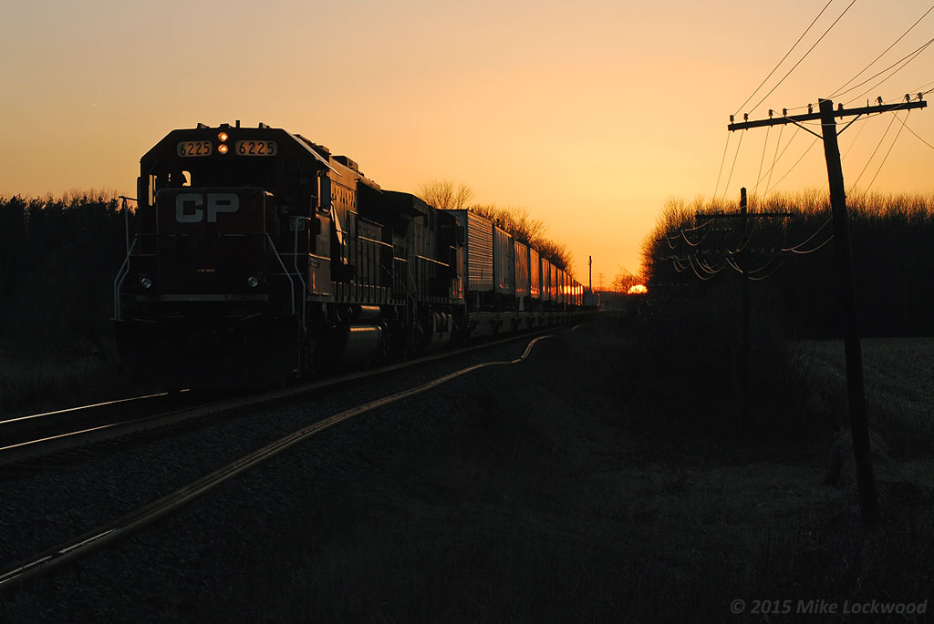 As the sun dips below the horizon, CP 6225, headlights dimmed, approaches Whitby and a meet with 551. 1951hrs.