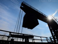 <b>And now for something a little different.. </b> A large counterweight sits in the 'up' position as the former Chesapeake and Ohio ferry dock rusts away in Sarnia. Last used 20 years ago in 1995, other than the rails and ferry dock track which were removed, it sits in place just as it was, along with the Ferry Dock yard office, itself in forelorn condition. Any rp.ca members or viewers have photos from this area in better times? Sign up and submit a photo if you feel up to it!<br><br>
From what I can tell the Sarnia ferry ran continuously from 1903 to 1995, at the end the ferry was used mostly to transfer over-height cars that could not fit in the tunnel at Windsor. For example, CAMI automotive traffic from Ingersoll would have been routed via CSX to Sarnia/Port Huron via the ferry in the early 90's. With the opening of the CN Tunnel and new haulage agreements, the ferry was no longer needed and closed.