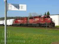 Working the corner of Front and Fifth, veteran SD40-2's CP 5795 and CP 5641 idle in the siding at Nipigon with a gang train, about to proceed eastward to some of the more remote locations along CP's trans-con route along the north shore of Superior.