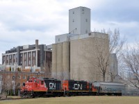 CN 7246 & CN 7015 prepare to leave Robin Hood flour mill with empties on the East Side Canal Bank spur on the north side of the Lachine canal.