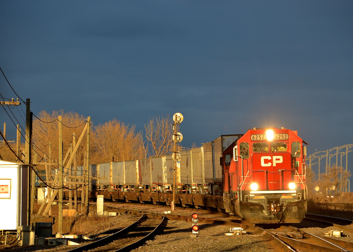 Sun and storm clouds. CP 133 heads through Lachine with a pair of ex-SOO Line SD60's back to back (CP 6252 & CP 6228) not too long after the sun broke through some storm clouds.