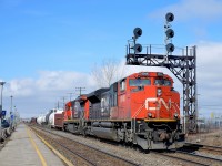 CN 586 is in theory empty TankTrain loads from Maitland, ON, but in practice has lots of non-TankTrain Brockville traffic. Here it passes through Dorval with CN 8948 & CN 2124 on a sunny and warm spring morning.