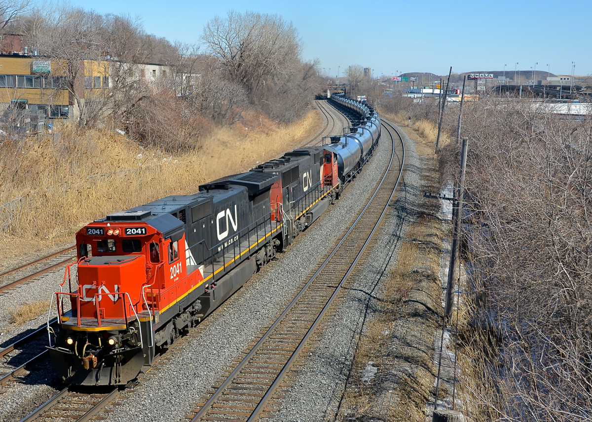 A clean Dash8 leading. CN 705 with oil empties for Alberta has a clean Dash8 leading a ragged looking SD75I (CN 2041 & CN 5737) as it departs Turcot West with 388 axles after a crew change.