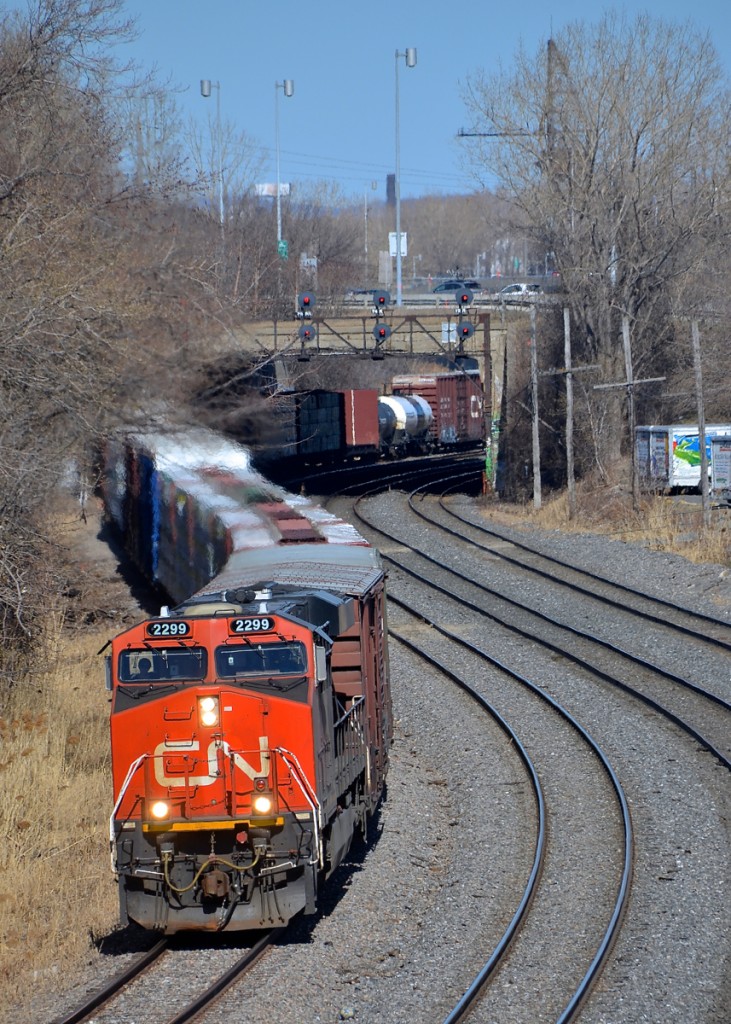 CN 2299 leads a very short CN 401 through Montreal West on the transfer track of CN's Montreal sub.