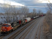 CN 5712 & CN 2306 head east with CN 400 about an hour before sunset.