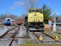 <b>SLQ 3569 and some passenger equipment.</b> SLQ 3569 was built as CN 2569 by Montreal Locomotive Works in 1976 and renumbered to CN 3569 in 1987. It was sold to the St. Lawrence & Atlantic where it kept the same number and they donated it to Exporail where it now resides. Also visible is a number of pieces of passenger equipment, including an ex-AMT car and a pair of CP RDC's at left and an ex-CN MU car at right.