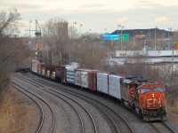 CN 711 has quite a bit of mixed freight at the head end as it slowly departs Turcot West with a new crew and with CN 5651 and CN 5563 as power.