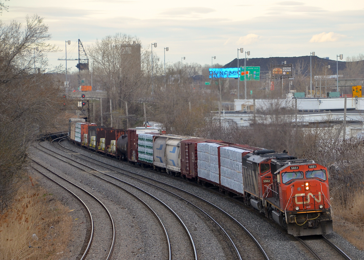 CN 711 has quite a bit of mixed freight at the head end as it slowly departs Turcot West with a new crew and with CN 5651 and CN 5563 as power.