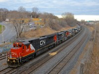 <b>Lots of power on CN 529.</b> CN 529 has 6 units (CN 2030, CN 8883, NS 9715, NS 6815, NS 9908 & NS 9955), including a recently painted ex-UP Dash8-40C leading as it passes through Montreal West.