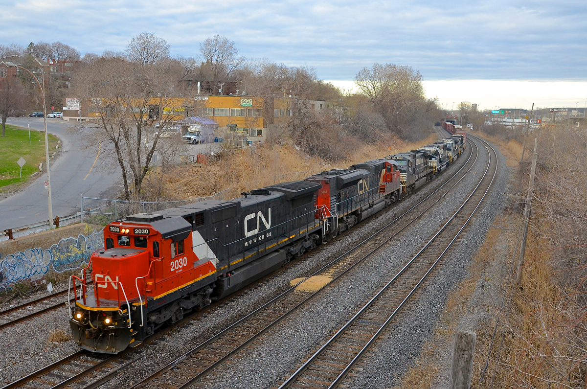Lots of power on CN 529. CN 529 has 6 units (CN 2030, CN 8883, NS 9715, NS 6815, NS 9908 & NS 9955), including a recently painted ex-UP Dash8-40C leading as it passes through Montreal West.