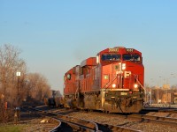 CP 9353 & CP 6252 blast through Dorval with the westbound Expressway about half an hour before sunset.