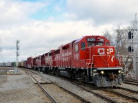 CP 318 has three GP38-2's as it prepares to pass Lasalle station on its way to Iberville and interchange with the CMQ.