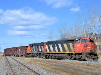 <b>Back on the Rouses Point sub with a pair of Zebras.</b> CN 913 (loaded ballast train) is back on the Rouses Point sub with CN 2413 and CN 4808 after having to back onto the little used Massena spur (at left) to allow CN 323 and CN 522 to proceed northwards. It can now head south and drop ballast on the Rouses Point sub as planned.