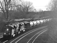 CN 710 is  coming out of the sun with CN 2813, CN 2815 & BNSF 4617 as power. 