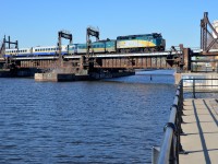 VIA 30 is about 20 minutes late as it crosses the Lachine Canal with VIA 6445 leading three LRC cars.