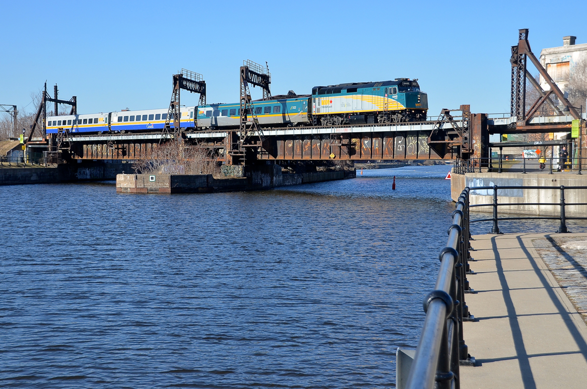 VIA 30 is about 20 minutes late as it crosses the Lachine Canal with VIA 6445 leading three LRC cars.