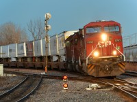 <b>An 'Unstoppable' piggyback train.</b> CP 133, the westbound Expressway (only dedicated piggyback train in Canada) has CP 9782 leading, its plow still striped from when it was in the movie <i>Unstoppable</i>. Trailing are two SD40-2's (CP 6613 & CP 5763) as it heads west through Lachine about half an hour before sunset.